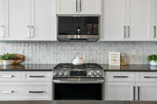 363 Precedence Hill, Cochrane, AB - Indoor Photo Showing Kitchen With Upgraded Kitchen