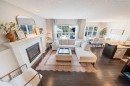 219 Auburn Springs Close Se, Calgary, AB  - Indoor Photo Showing Living Room With Fireplace 