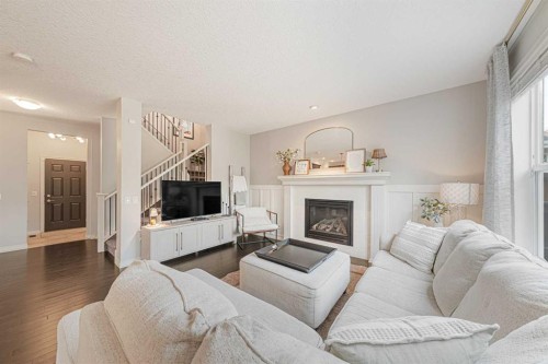 219 Auburn Springs Close Se, Calgary, AB - Indoor Photo Showing Living Room With Fireplace