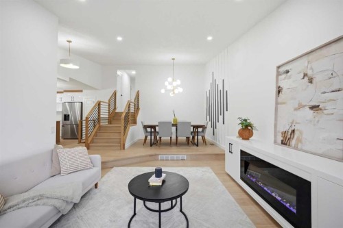 300 Edgehill Drive Nw, Calgary, AB - Indoor Photo Showing Living Room With Fireplace