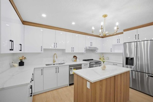 300 Edgehill Drive Nw, Calgary, AB - Indoor Photo Showing Kitchen With Stainless Steel Kitchen With Double Sink With Upgraded Kitchen