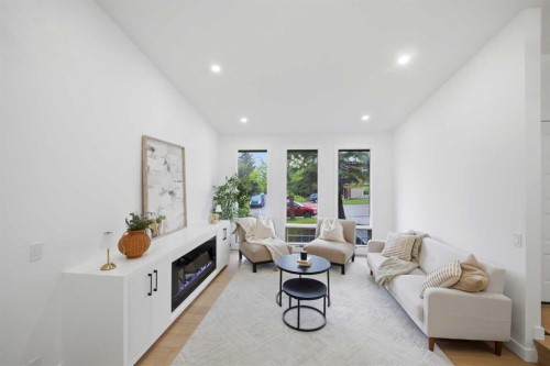 300 Edgehill Drive Nw, Calgary, AB - Indoor Photo Showing Living Room With Fireplace