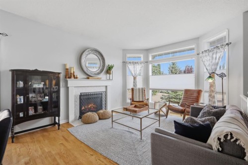 6103 58 Street, Olds, AB - Indoor Photo Showing Living Room With Fireplace