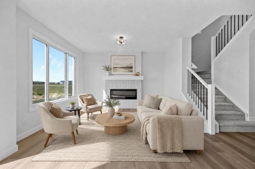 149 Creekside Street Sw, Calgary, AB - Indoor Photo Showing Living Room With Fireplace