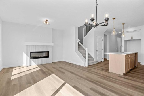 149 Creekside Street Sw, Calgary, AB - Indoor Photo Showing Other Room With Fireplace