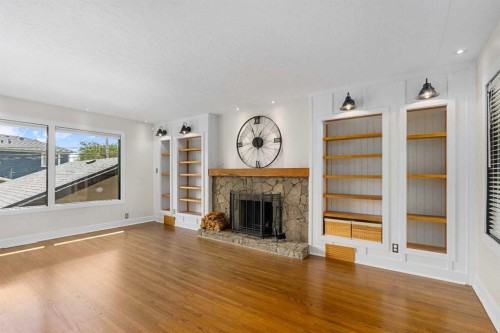 119 Coleridge Road Nw, Calgary, AB - Indoor Photo Showing Living Room With Fireplace