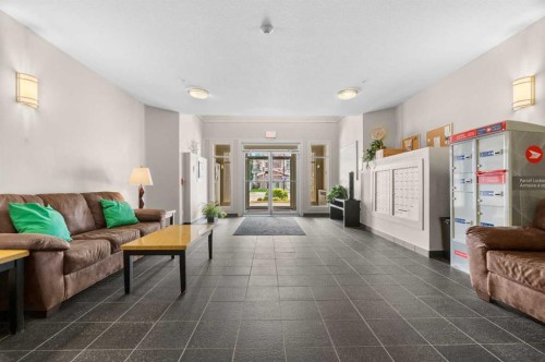 411-28 Auburn Bay Link Se, Calgary, AB - Indoor Photo Showing Living Room