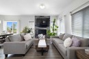 153 Sandstone Drive, Okotoks, AB  - Indoor Photo Showing Living Room With Fireplace 