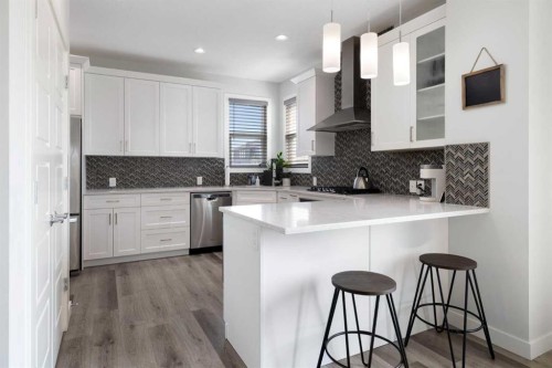 153 Sandstone Drive, Okotoks, AB - Indoor Photo Showing Kitchen With Upgraded Kitchen