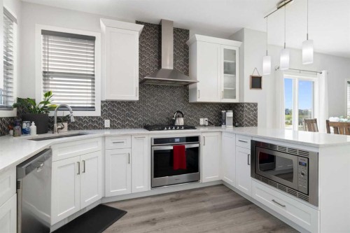 153 Sandstone Drive, Okotoks, AB - Indoor Photo Showing Kitchen With Upgraded Kitchen