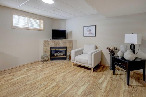 8 Canoe Road Sw, Airdrie, AB - Indoor With Fireplace
