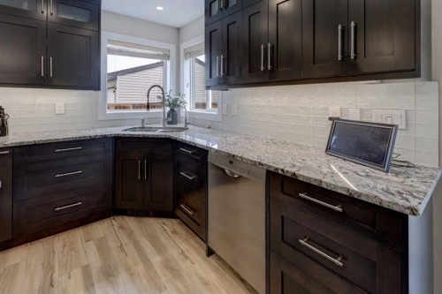 8 Canoe Road Sw, Airdrie, AB - Indoor Photo Showing Kitchen With Upgraded Kitchen