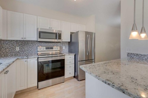 34 Eversyde Common Sw, Calgary, AB - Indoor Photo Showing Kitchen With Stainless Steel Kitchen With Upgraded Kitchen