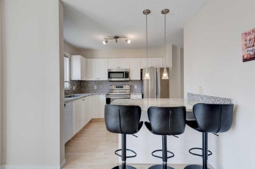 34 Eversyde Common Sw, Calgary, AB - Indoor Photo Showing Kitchen With Stainless Steel Kitchen With Upgraded Kitchen