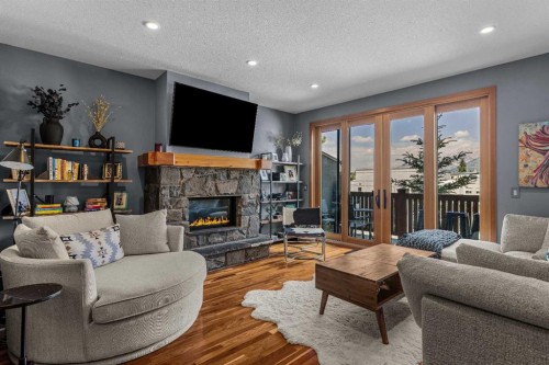 8-511 6Th Avenue, Canmore, AB - Indoor Photo Showing Living Room With Fireplace