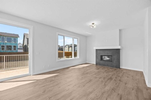 35 Creekside Rise Sw, Calgary, AB - Indoor Photo Showing Living Room With Fireplace