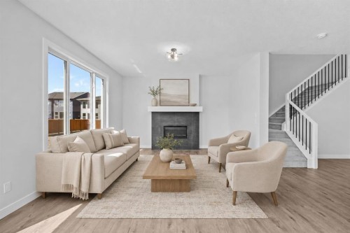 35 Creekside Rise Sw, Calgary, AB - Indoor Photo Showing Living Room With Fireplace