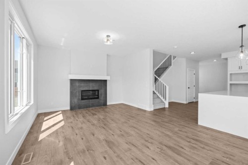35 Creekside Rise Sw, Calgary, AB - Indoor Photo Showing Living Room With Fireplace