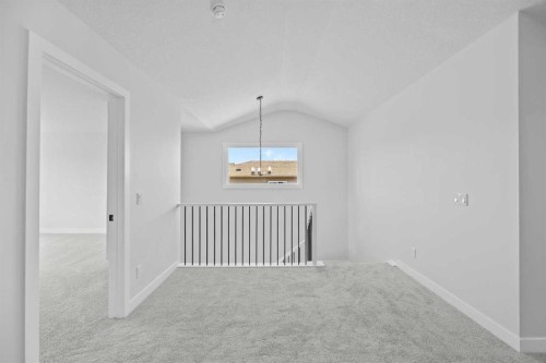 35 Creekside Rise Sw, Calgary, AB - Indoor Photo Showing Other Room
