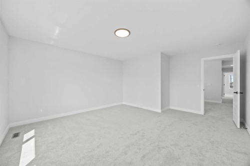 35 Creekside Rise Sw, Calgary, AB - Indoor Photo Showing Other Room