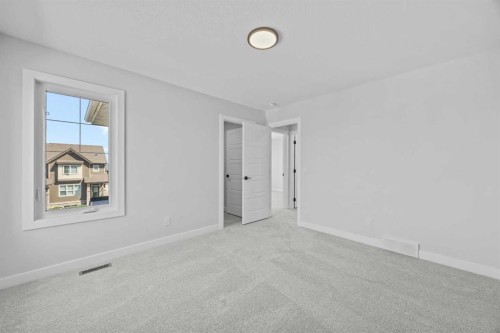35 Creekside Rise Sw, Calgary, AB - Indoor Photo Showing Other Room