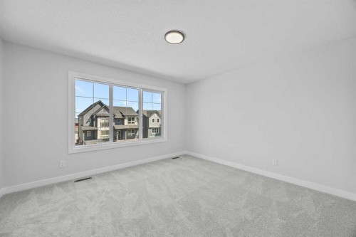 35 Creekside Rise Sw, Calgary, AB - Indoor Photo Showing Other Room