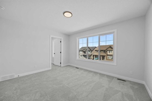 35 Creekside Rise Sw, Calgary, AB - Indoor Photo Showing Other Room