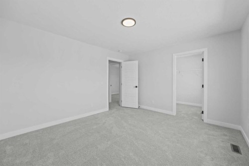 35 Creekside Rise Sw, Calgary, AB - Indoor Photo Showing Other Room