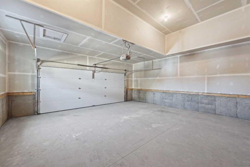 35 Creekside Rise Sw, Calgary, AB - Indoor Photo Showing Garage