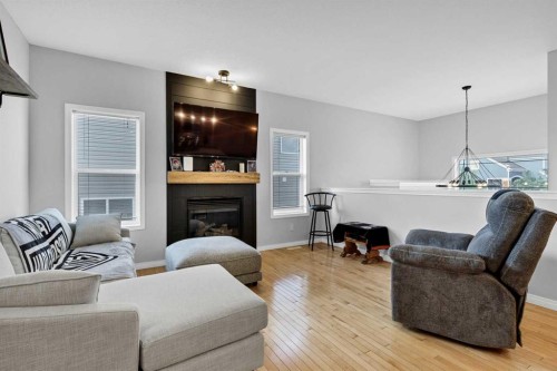 738 Carriage Lane Drive, Carstairs, AB - Indoor Photo Showing Living Room With Fireplace