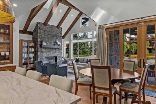 533 3Rd Street, Canmore, AB - Indoor Photo Showing Dining Room With Fireplace