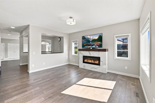 11 Savanna Villas Ne, Calgary, AB - Indoor Photo Showing Living Room With Fireplace