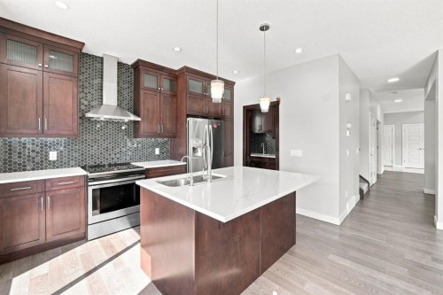 11 Savanna Villas Ne, Calgary, AB - Indoor Photo Showing Kitchen With Stainless Steel Kitchen With Double Sink With Upgraded Kitchen