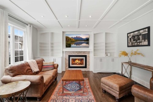 606 Schubert Place Nw, Calgary, AB - Indoor Photo Showing Living Room With Fireplace