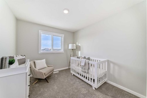 136 Heirloom Street Se, Calgary, AB - Indoor Photo Showing Bedroom