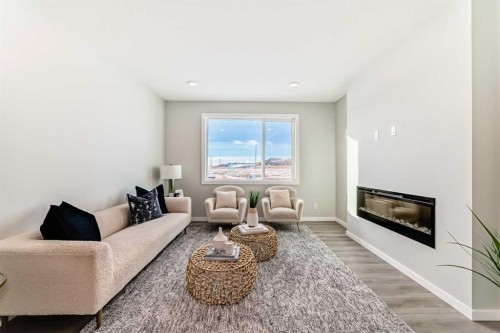 136 Heirloom Street Se, Calgary, AB - Indoor Photo Showing Living Room With Fireplace