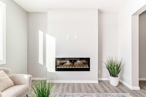136 Heirloom Street Se, Calgary, AB - Indoor Photo Showing Living Room With Fireplace