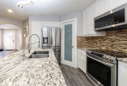 47 Everstone Boulevard Sw, Calgary, AB - Indoor Photo Showing Kitchen With Stainless Steel Kitchen With Double Sink With Upgraded Kitchen