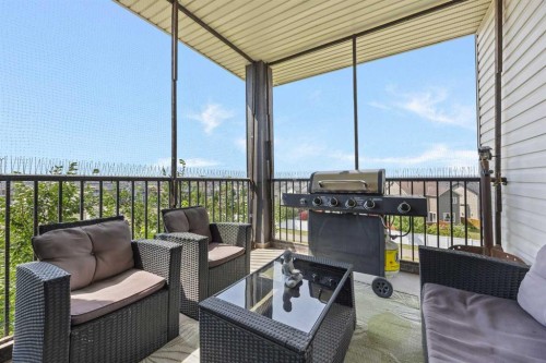 401-7110 80 Avenue Ne, Calgary, AB - Outdoor With Deck Patio Veranda With Exterior