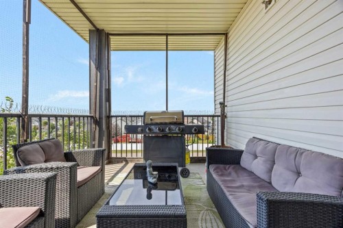 401-7110 80 Avenue Ne, Calgary, AB - Outdoor With Deck Patio Veranda With Exterior
