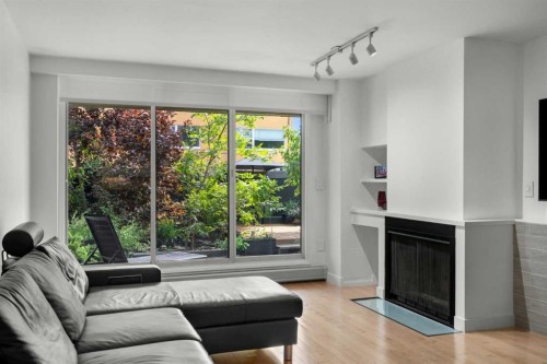 107-1732 9A Street Sw, Calgary, AB - Indoor Photo Showing Living Room With Fireplace