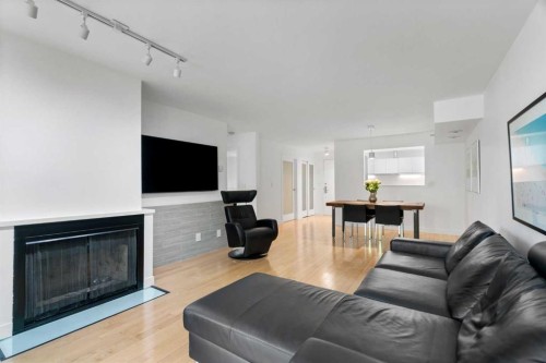 107-1732 9A Street Sw, Calgary, AB - Indoor Photo Showing Living Room With Fireplace