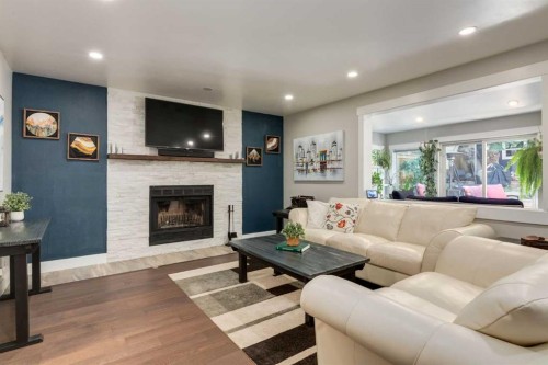 9915 Patton Road Sw, Calgary, AB - Indoor Photo Showing Living Room With Fireplace