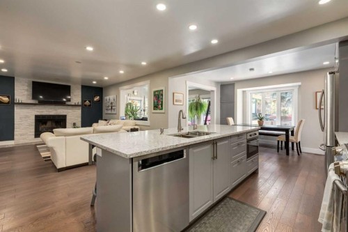 9915 Patton Road Sw, Calgary, AB - Indoor Photo Showing Kitchen With Fireplace With Double Sink With Upgraded Kitchen
