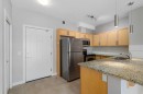 2307-604 East Lake Boulevard Ne, Airdrie, AB  - Indoor Photo Showing Kitchen With Double Sink 