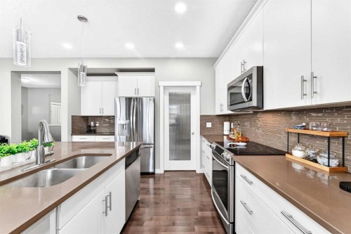 56 Evansborough Green Nw, Calgary, AB - Indoor Photo Showing Kitchen With Stainless Steel Kitchen With Double Sink With Upgraded Kitchen