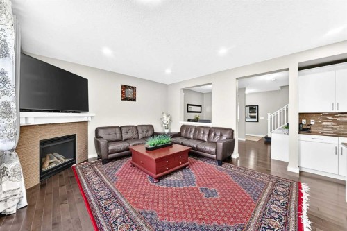 56 Evansborough Green Nw, Calgary, AB - Indoor Photo Showing Living Room With Fireplace