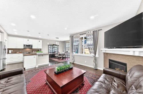 56 Evansborough Green Nw, Calgary, AB - Indoor Photo Showing Living Room With Fireplace