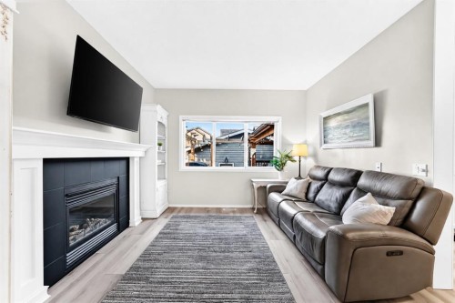 144 Copperstone Gardens, Calgary, AB - Indoor Photo Showing Living Room With Fireplace