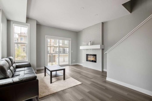 902 Sage Hill Grove Nw, Calgary, AB - Indoor Photo Showing Living Room With Fireplace